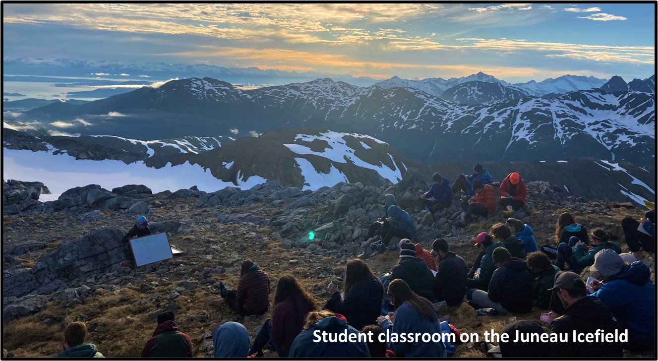 Photo showing students learning about glacier physics. Taken on the Juneau Icefield, Summer 2021.