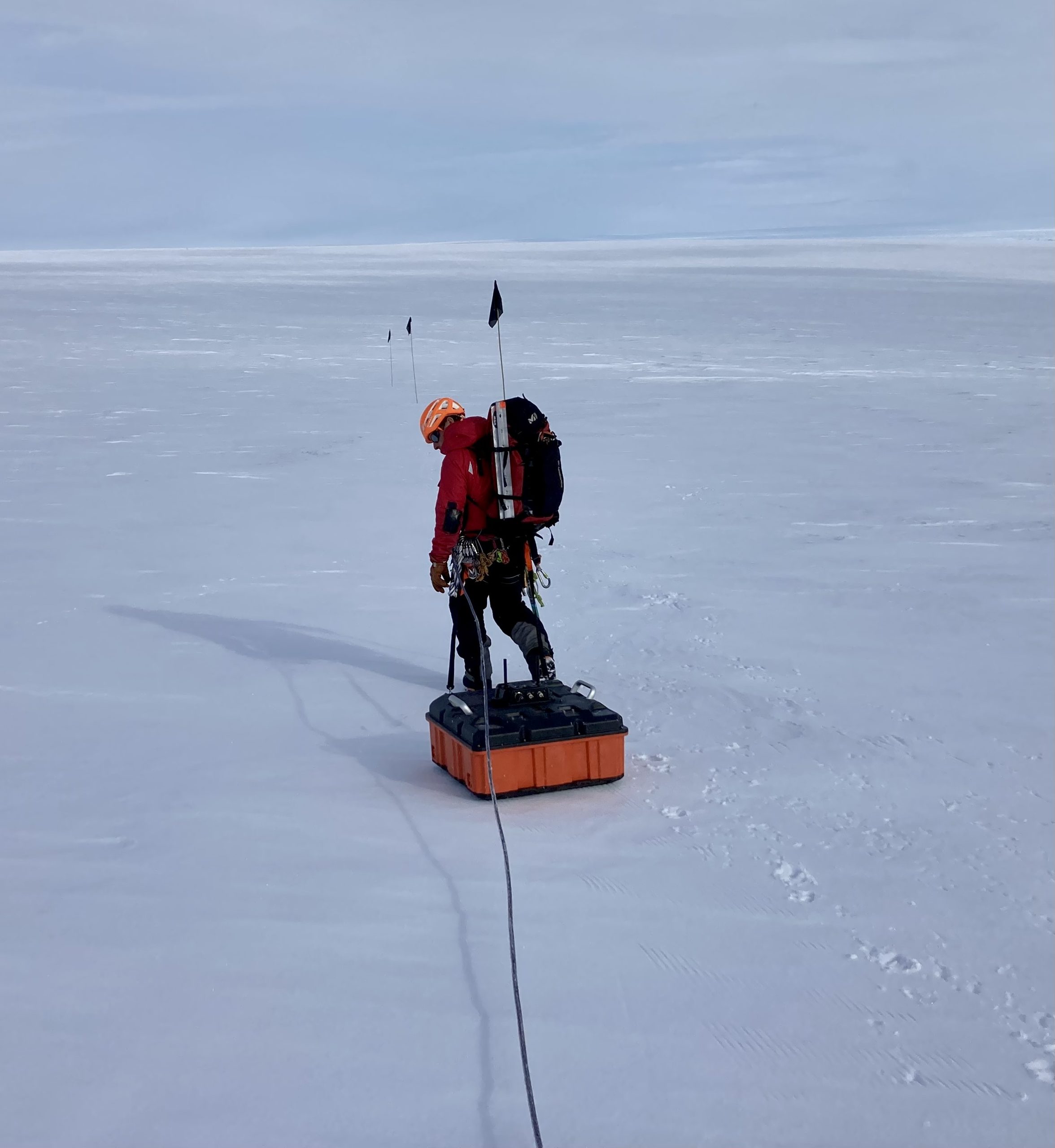 Person towing a ground-penetrating radar in West Antarctica