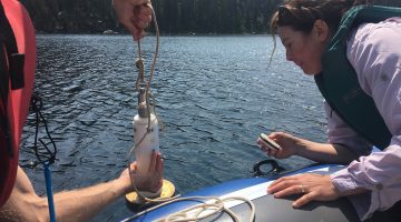 Pulling up sediment corer from Beauty Lake.