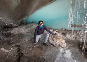 Heather Clifford, exploring an ice cave below the Quelccaya ice cap for an adequate space to store ice cores.