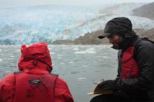 Team members recording CTD data at Témpano Glacier.