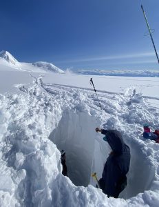 Excavating snow pit on Begguya plateau.
