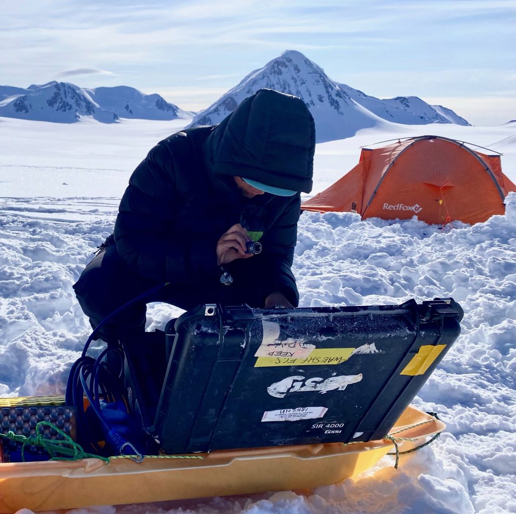 Photo of Renee Clavette setting up GPR system.