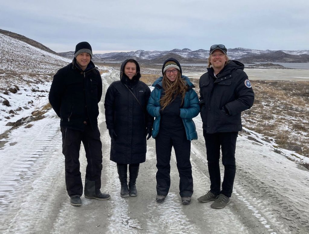 Crew photo in front of ATV road.