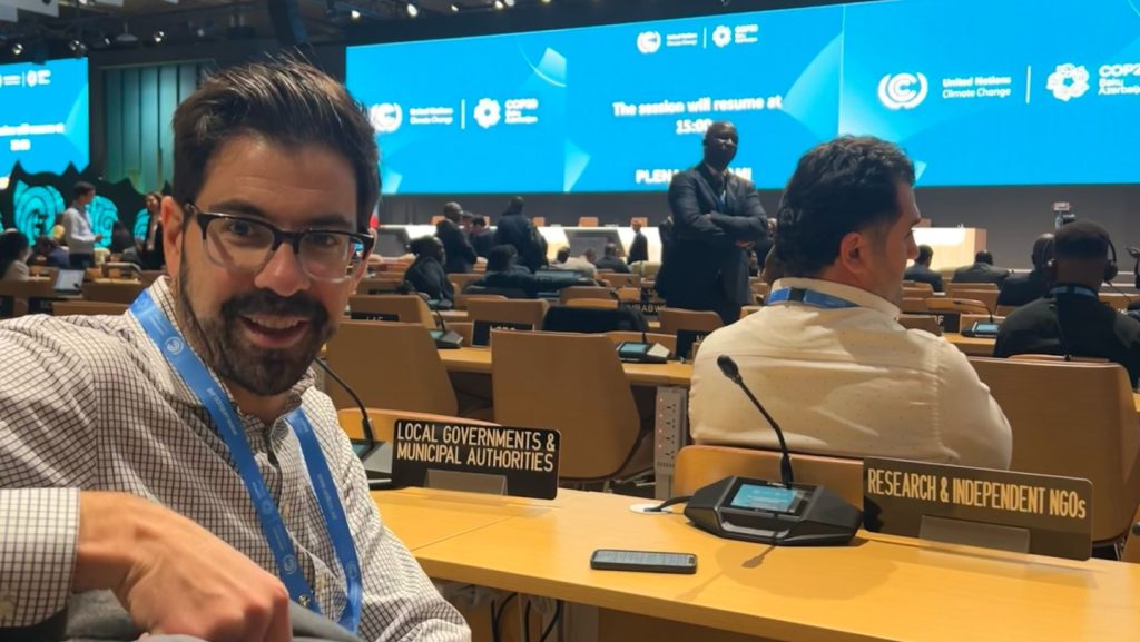 A photo of a man at a desk for COP 29