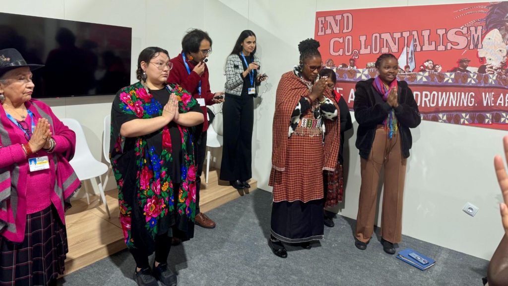 A photo of Morning opening prayer at the Indigenous Women's Day; Guardians of Mother Earth.