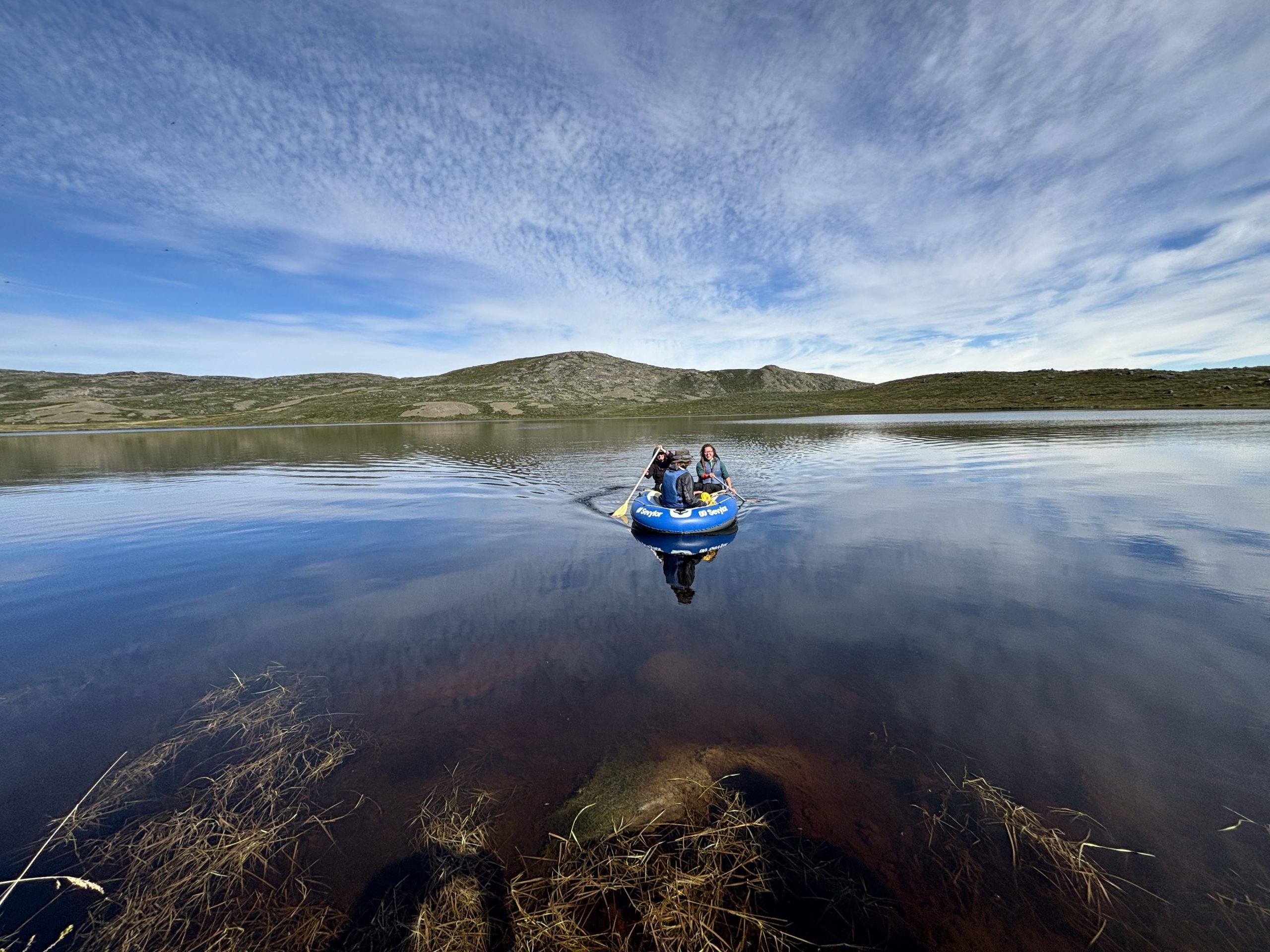 Researchers sample a lake near Kangerlussuaq, Greenland, that browned after the extreme events.