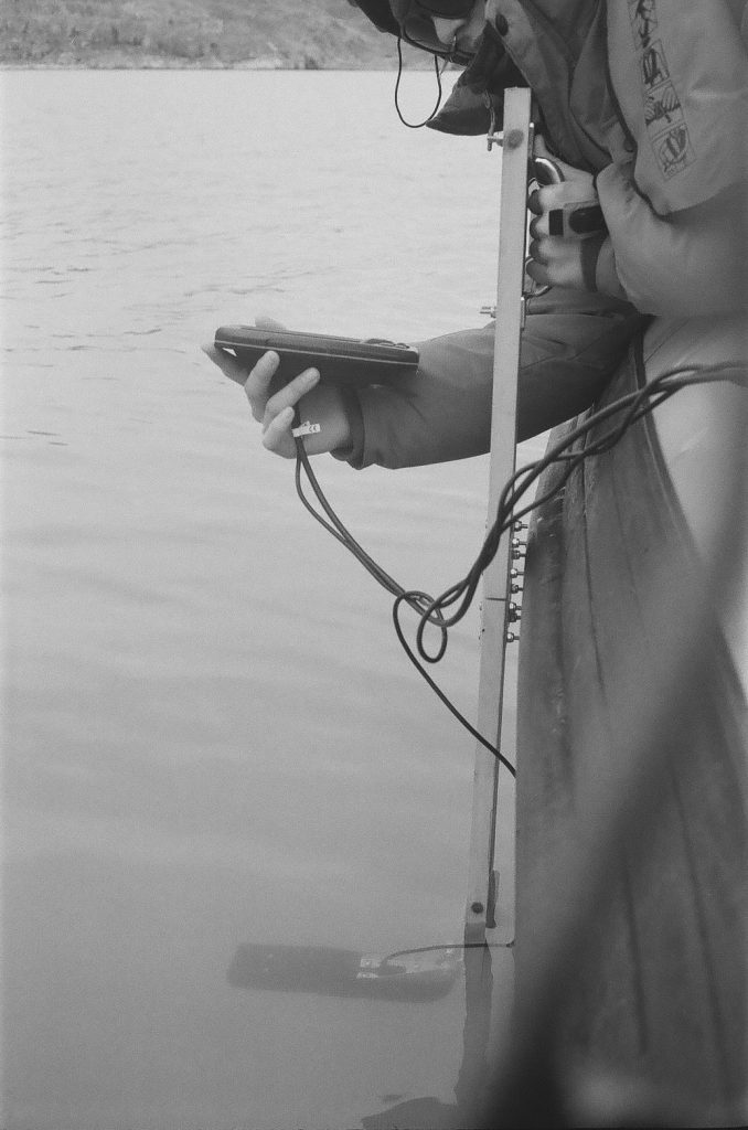 Measuring the depth of the fjord with depth sounder.
