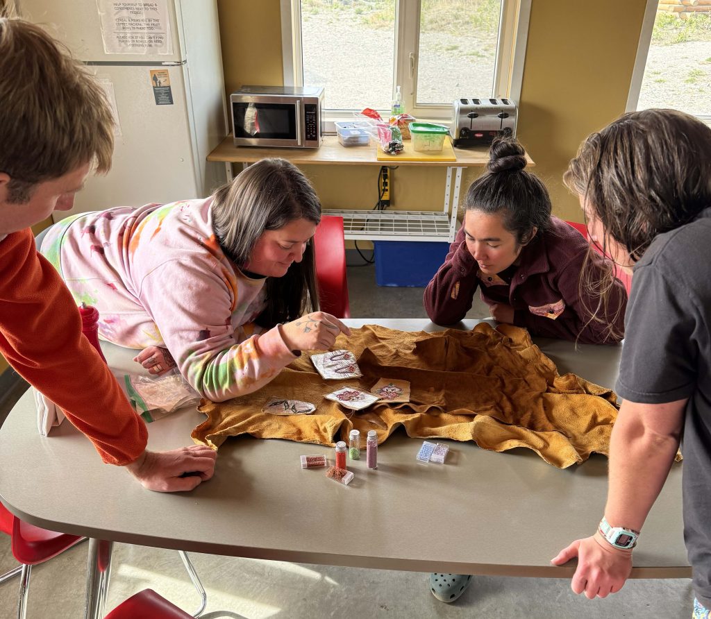 Teaching traditional beadwork to UMaine researchers.