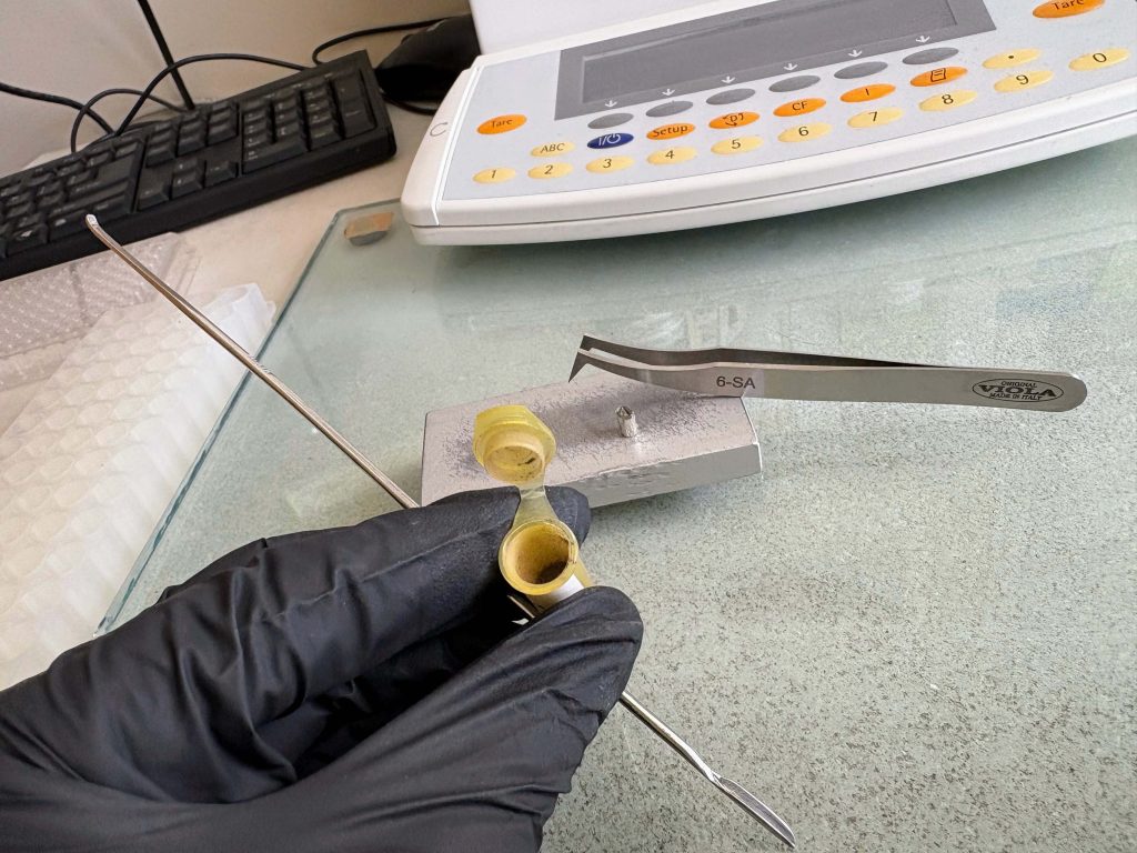 Photo of vial being prepared for sample.